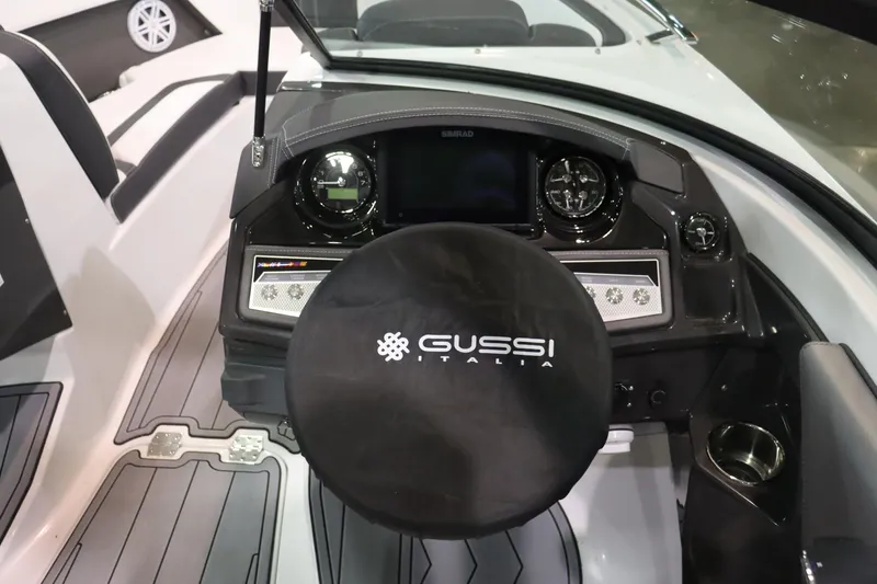 Slide: The Image of 2023 Monterey 238 Super Sport boat dashboard with Gussi Italia steering wheel cover. - 8
