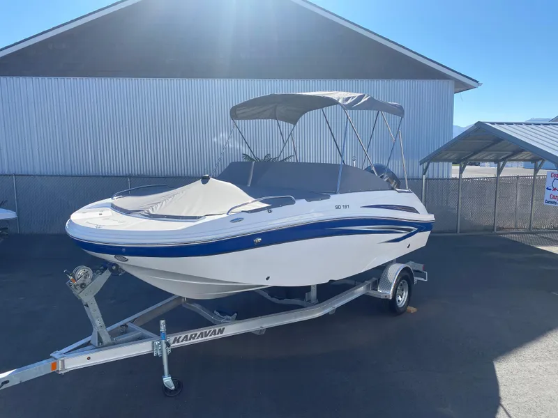 The Image of 2022 Hurricane SD 191 OB boat on Karavan trailer, parked outdoors. - 1