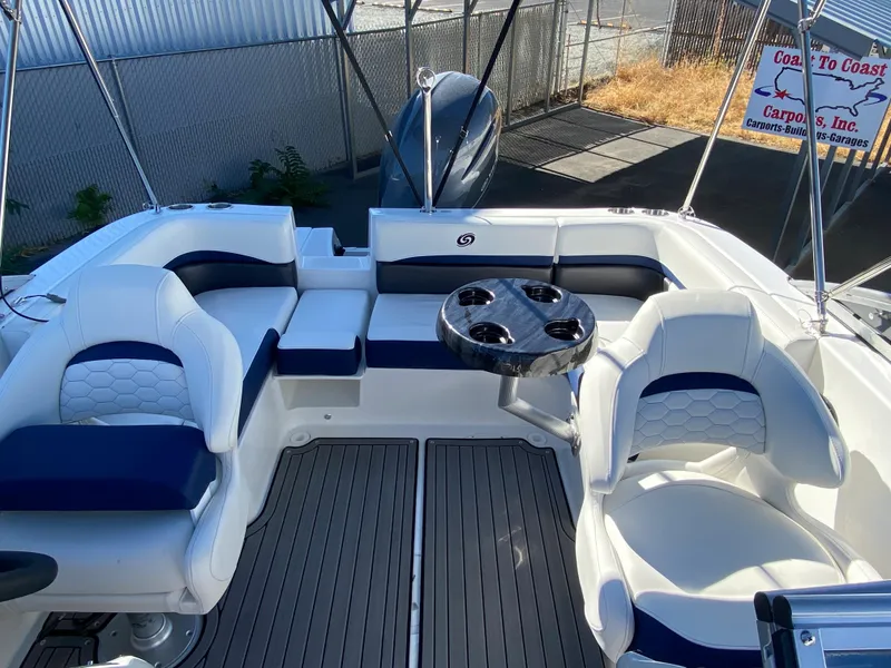 Slide: The Image of 2022 Hurricane SD 191 OB boat interior with white and blue seating. - 4
