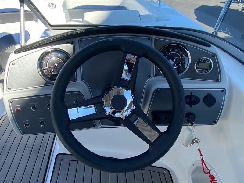 Slide: The Image of 2022 Hurricane SD 191 OB boat dashboard with steering wheel and instrument panel. - 6