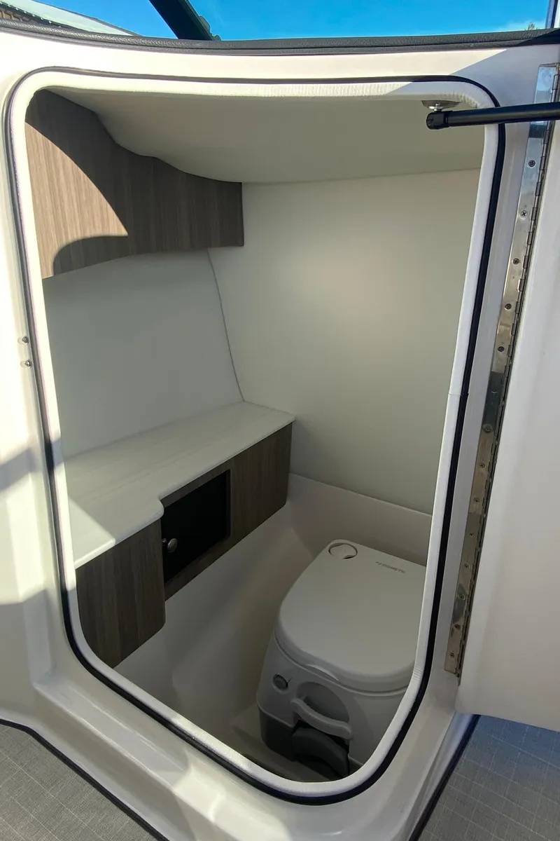 Slide: The Image of 2023 Regal LS6 Surf boat interior bathroom with modern design. - 8