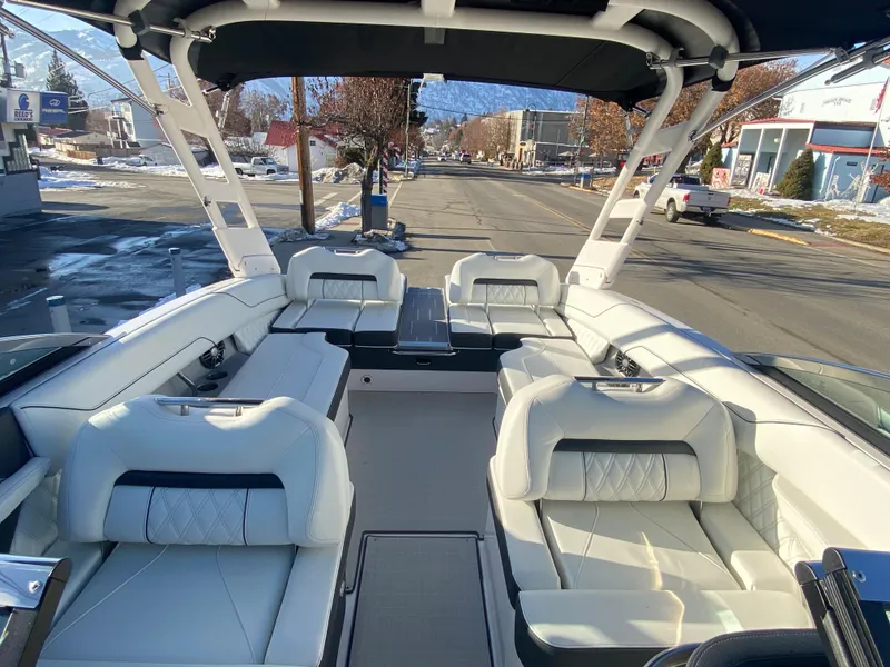 Slide: The Image of 2023 Regal LS6 Surf boat with spacious seating and modern design. - 9