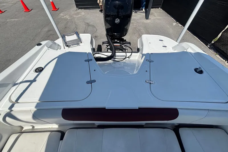 Slide: The Image of 2019 Tahoe 550 TF boat deck with motor and storage compartments. - 56