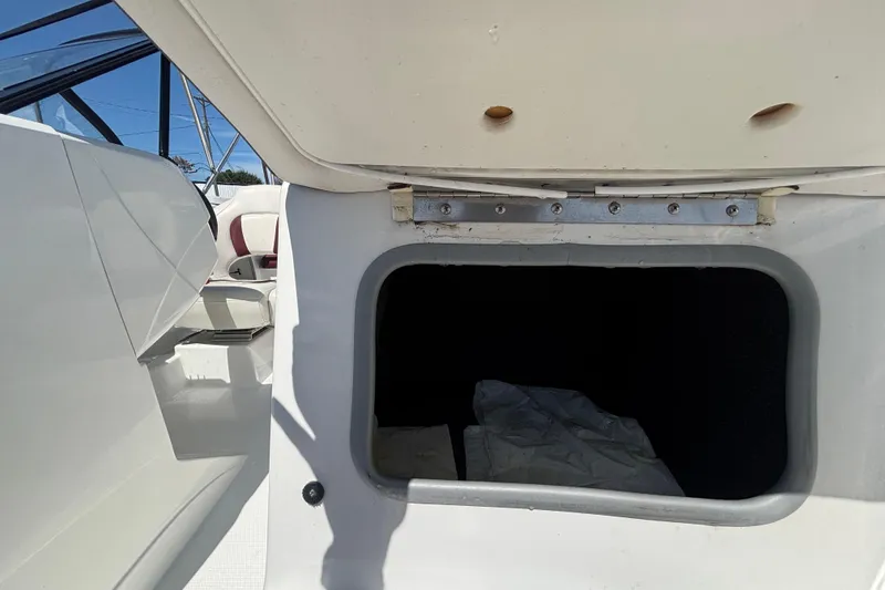 Slide: The Image of Open storage compartment on a 2019 Tahoe 550 TF boat, showcasing interior space. - 44