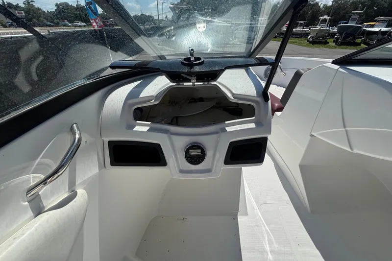 Slide: The Image of Interior view of a 2019 Tahoe 550 TF boat cockpit with steering and dashboard. - 21