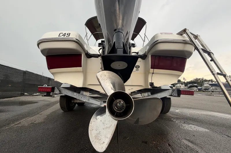 Slide: The Image of Rear view of a 2019 Tahoe 550 TS boat on a trailer, showcasing the propeller. - 4