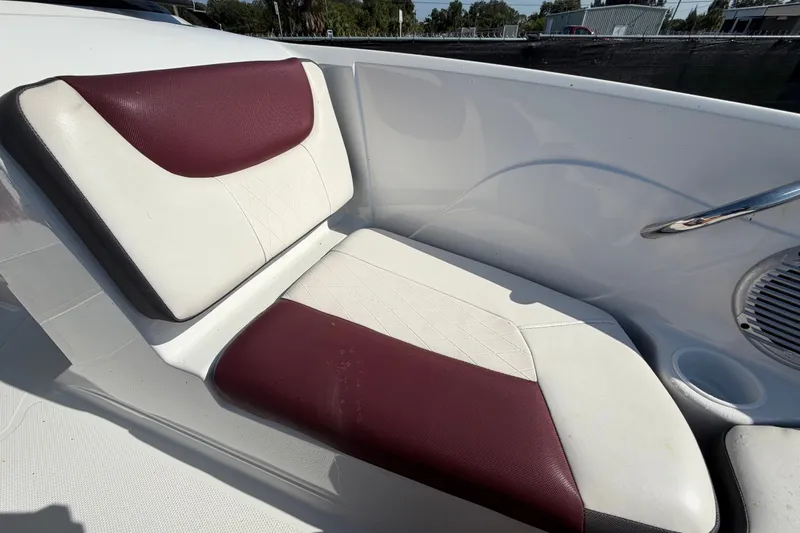 Slide: The Image of 2019 Tahoe 550 TS boat seat with maroon and white upholstery. - 40