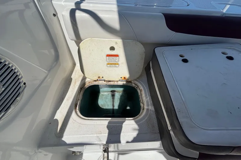 Slide: The Image of Open storage compartment on a 2019 Tahoe 550 TF boat deck. - 52