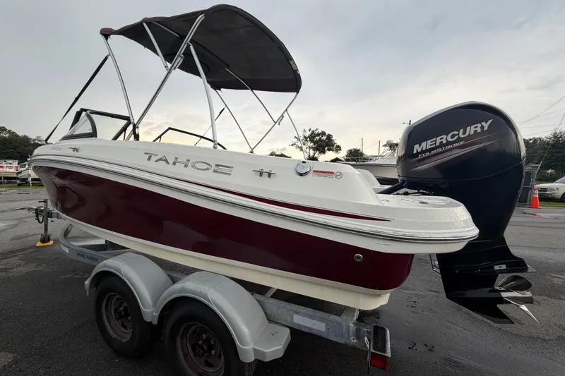 Slide: The Image of 2019 Tahoe 550 TS boat with Mercury outboard engine on trailer. - 5