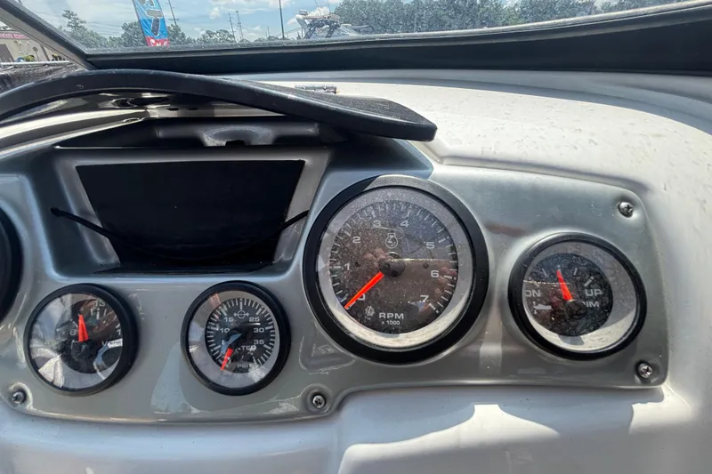 Slide: The Image of Dashboard of a 2019 Tahoe 550 TF boat with gauges and controls. - 26