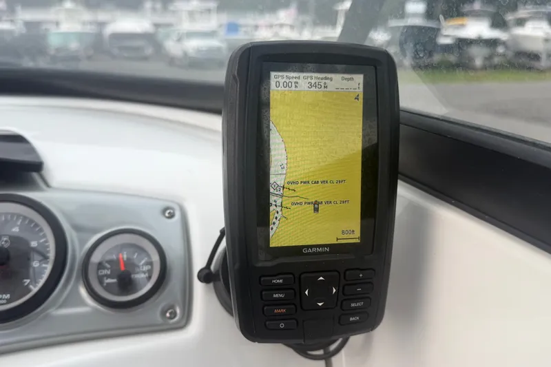 Slide: The Image of Garmin GPS device on 2019 Tahoe 550 TS boat dashboard, displaying navigation map. - 27