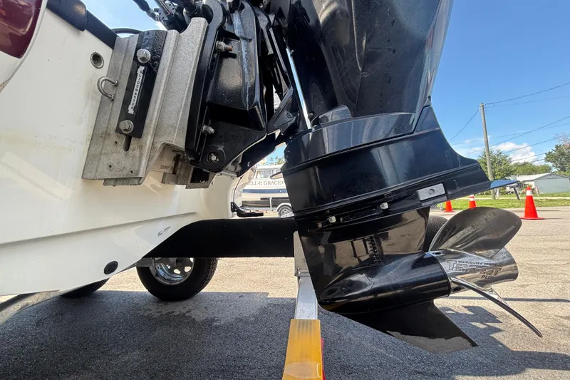 Slide: The Image of Close-up of a 2019 Tahoe 550 TF boat motor and propeller on a sunny day. - 6