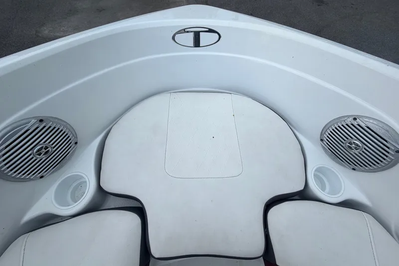 Slide: The Image of The image shows the bow area of a 2019 Tahoe 550 TS with white cushions and speakers. - 34