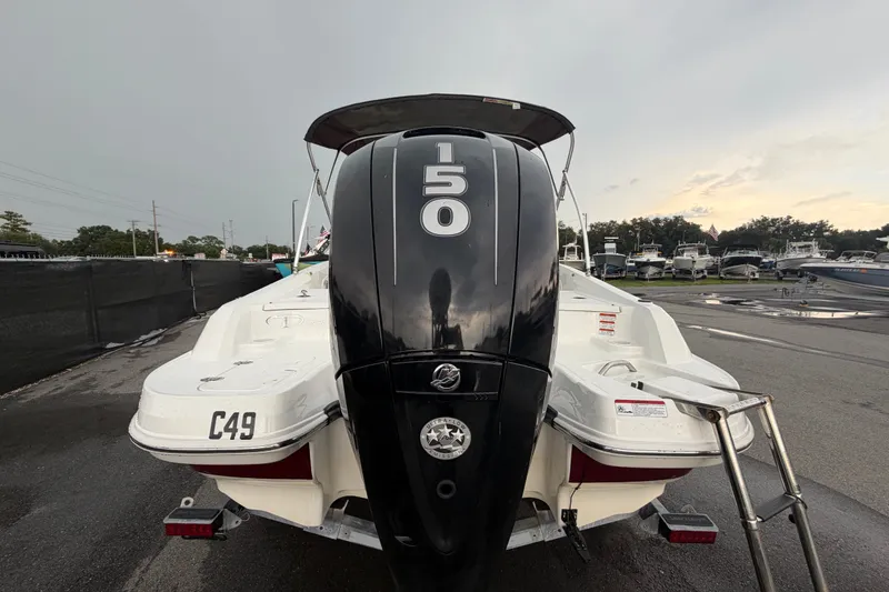 Slide: The Image of 2019 Tahoe 550 TS boat with powerful outboard motor, parked in a marina. - 3