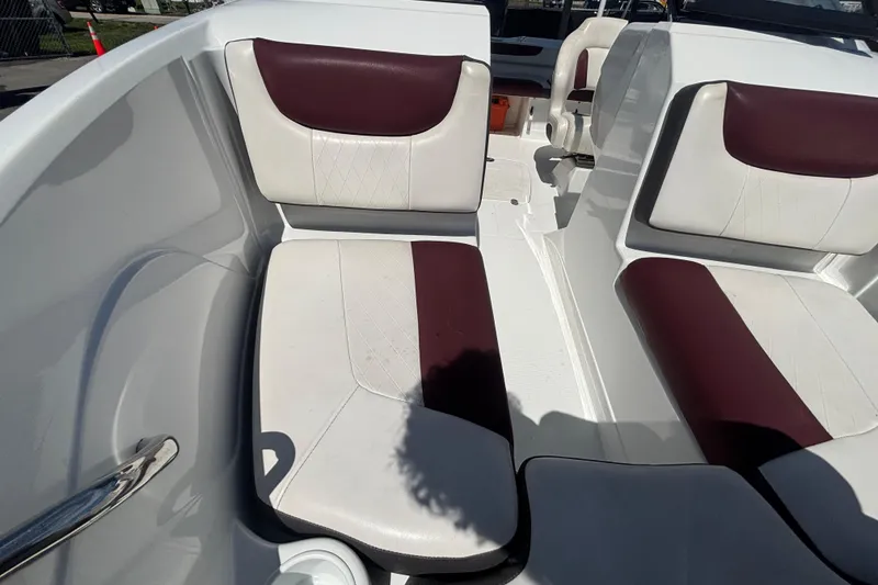 Slide: The Image of 2019 Tahoe 550 TF boat interior with white and maroon seating. - 39