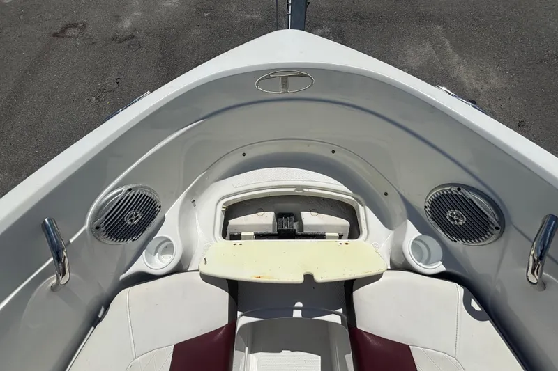 Slide: The Image of The image shows the bow deck of a 2019 Tahoe 550 TF boat with speakers and grab handles. - 35