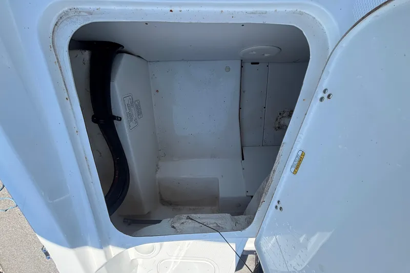 Slide: The Image of Open storage compartment in a 2019 Tahoe 550 TF boat. - 60