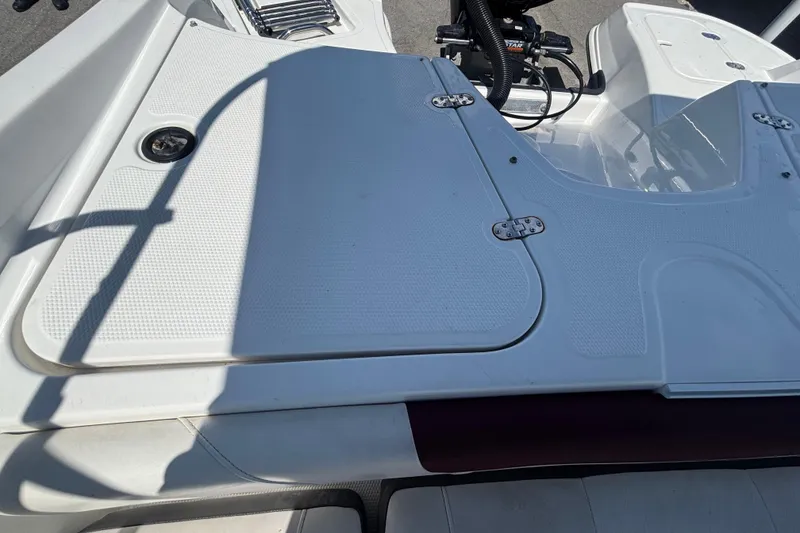 Slide: The Image of 2019 Tahoe 550 TF boat deck with storage compartment and ladder. - 57