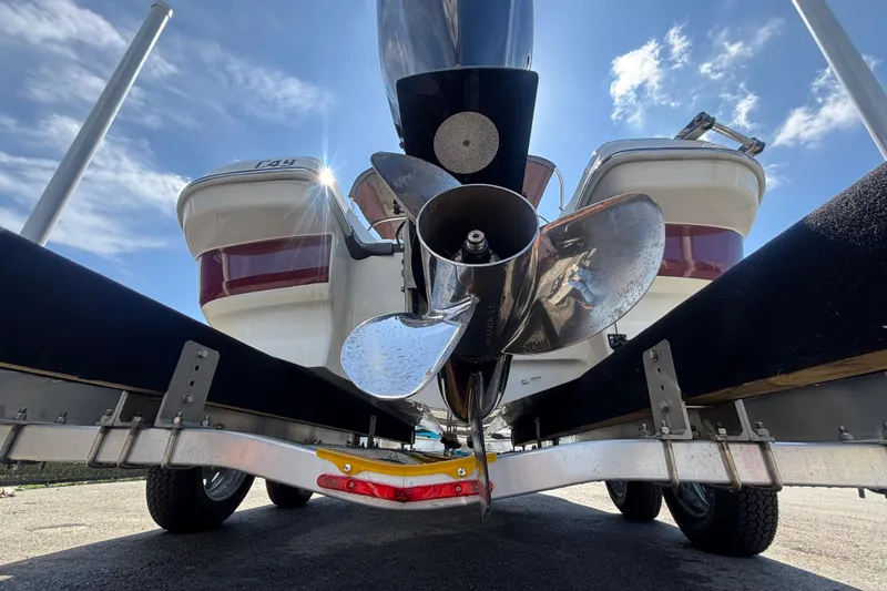 Slide: The Image of 2019 Tahoe 550 TF boat propeller and trailer under a clear blue sky. - 4
