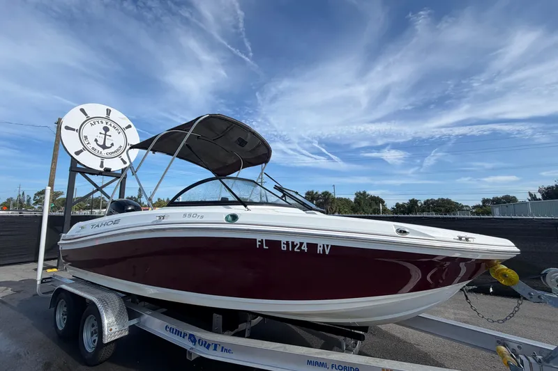 The Image of 2019 Tahoe 500 TF boat on trailer under clear sky, displayed at a dealership. - 0
