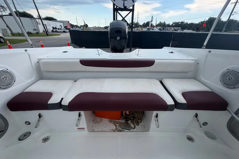 Slide: The Image of 2019 Tahoe 550 TS boat interior with cushioned seating and storage area. - 50