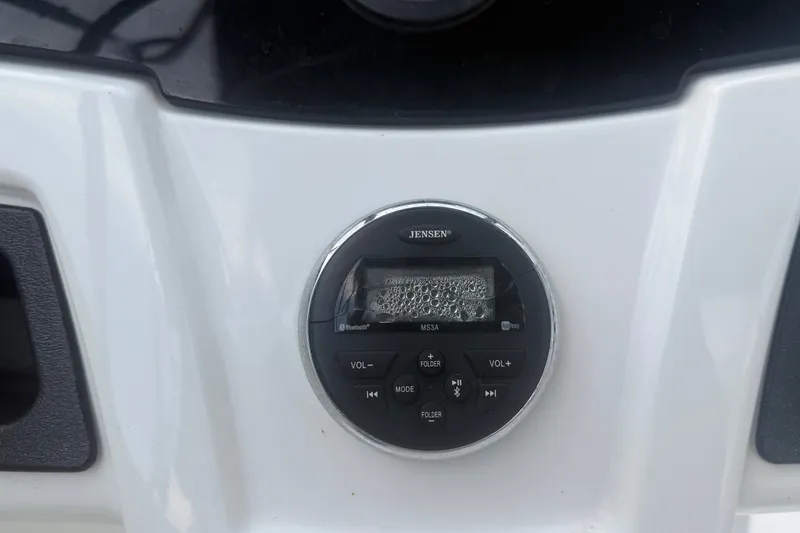 Slide: The Image of Jensen audio system on 2019 Tahoe 550 TS boat dashboard, featuring control buttons. - 22