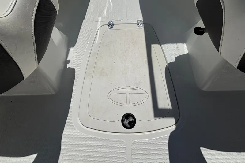 Slide: The Image of Interior view of a 2019 Tahoe 550 TF boat, featuring seating and storage compartment. - 16