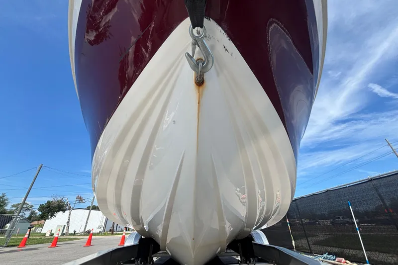 Slide: The Image of 2019 Tahoe 550 TF boat hull close-up with blue sky background. - 11