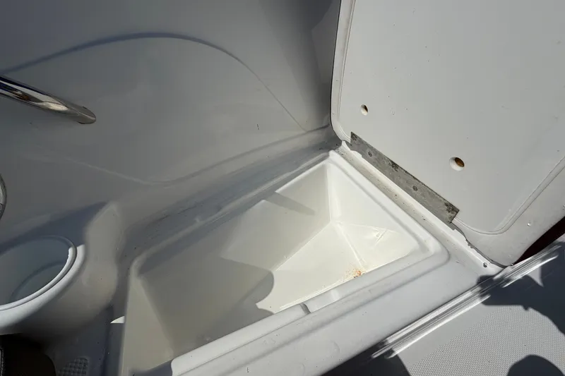 Slide: The Image of Open storage compartment in 2019 Tahoe 550 TS boat interior. - 39