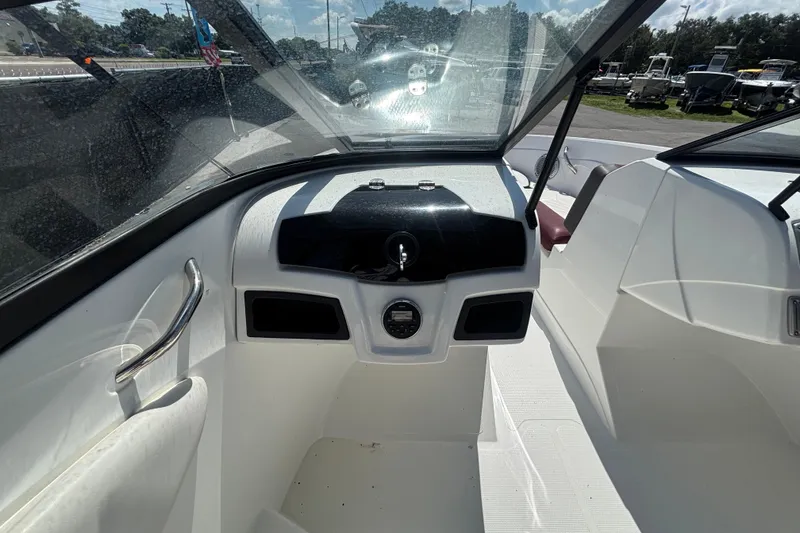Slide: The Image of 2019 Tahoe 550 TF boat interior with steering console and windshield. - 20