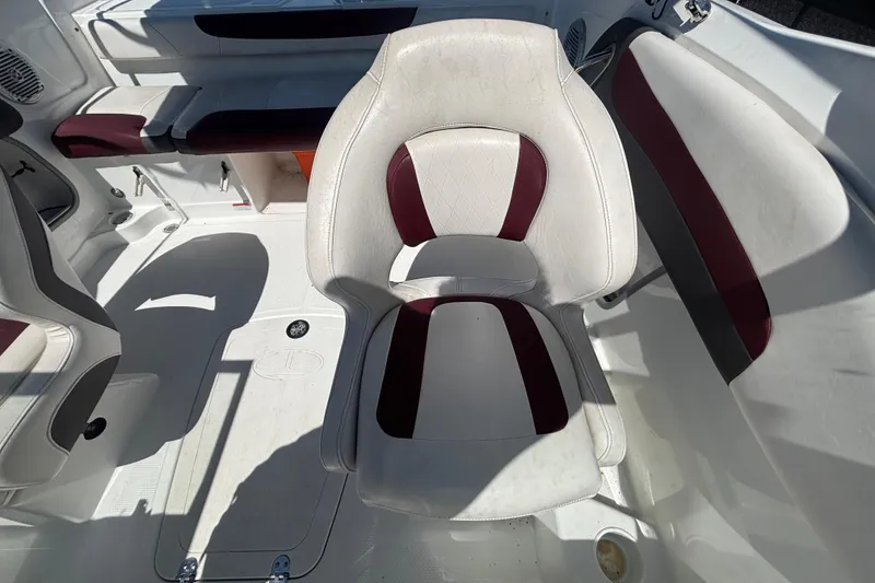 Slide: The Image of 2019 Tahoe 550 TF boat interior with white and maroon seating. - 48