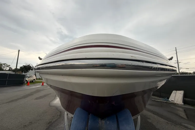 Slide: The Image of 2019 Tahoe 550 TS boat on trailer, viewed from front, overcast sky. - 8