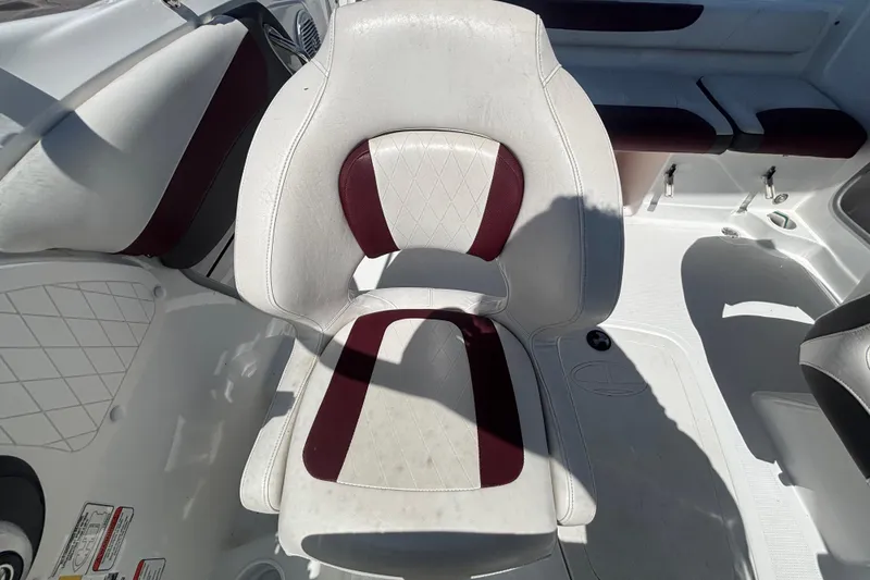 Slide: The Image of 2019 Tahoe 550 TF boat interior with white and maroon seating. - 47