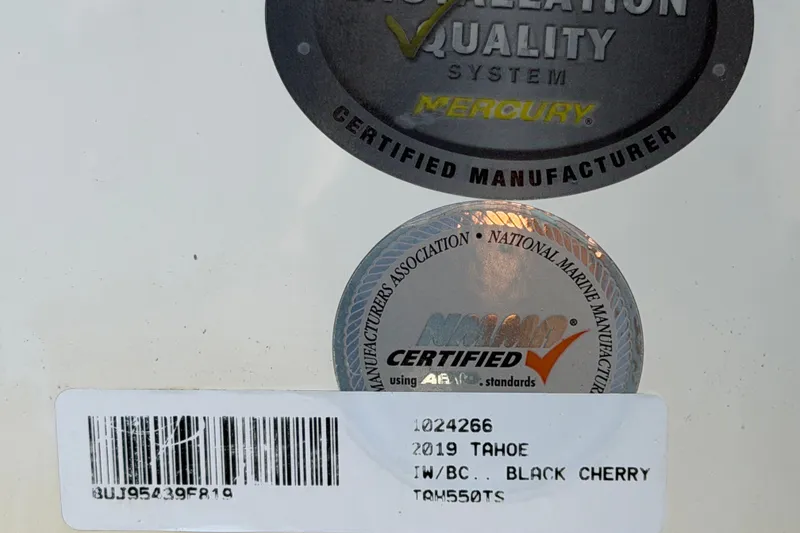 Slide: The Image of 2019 Tahoe 550 TS certification labels and barcode on a white surface. - 66