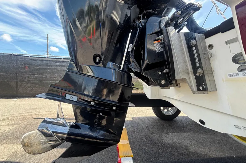 Slide: The Image of Close-up of a 2019 Tahoe 550 TF boat motor and propeller on a sunny day. - 5