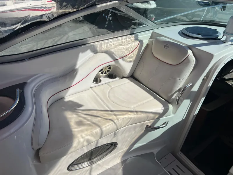 Slide: The Image of Interior seating of a 2007 Crownline 250 CR boat with white upholstery. - 10