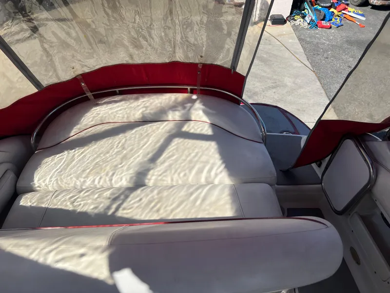 Slide: The Image of 2007 Crownline 250 CR boat interior with white leather seating and red accents. - 12