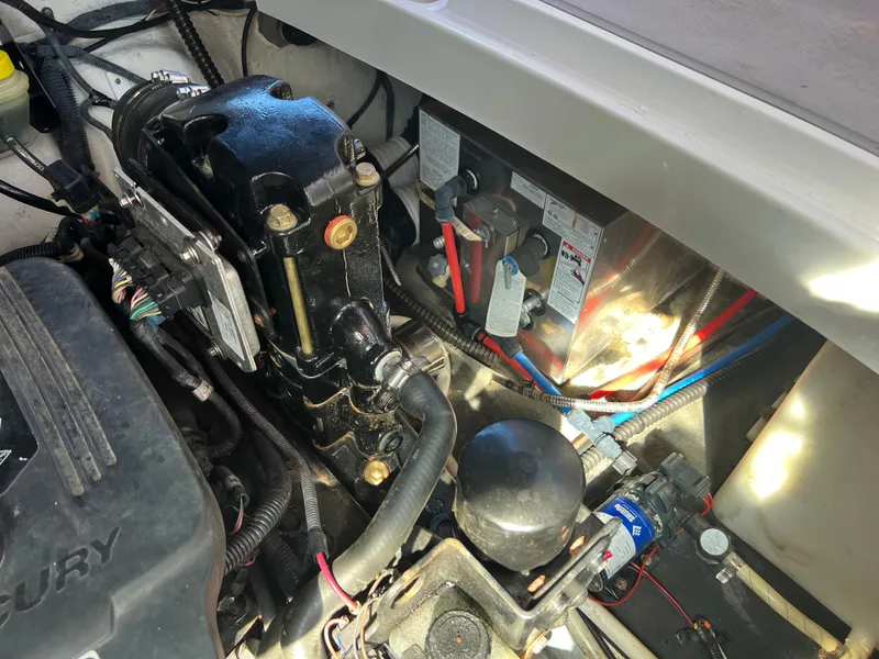 Slide: The Image of Engine compartment of a 2007 Crownline 250 CR boat showing mechanical components. - 29