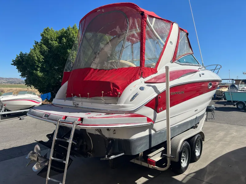 Slide: The Image of 2007 Crownline 250 CR boat with red canopy on trailer. - 5