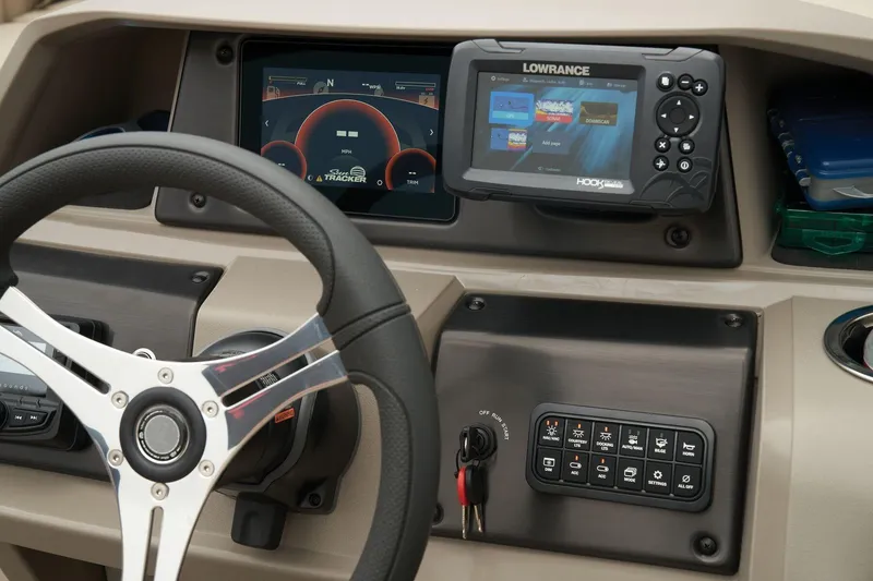 Slide: The Image of Dashboard of 2023 Sun Tracker SportFish 22 XP3 with steering wheel and navigation system. - 7