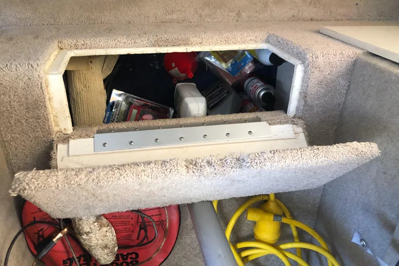 Slide: The Image of Storage compartment in a 1998 Bayliner 2452 Ciera Express boat. - 16