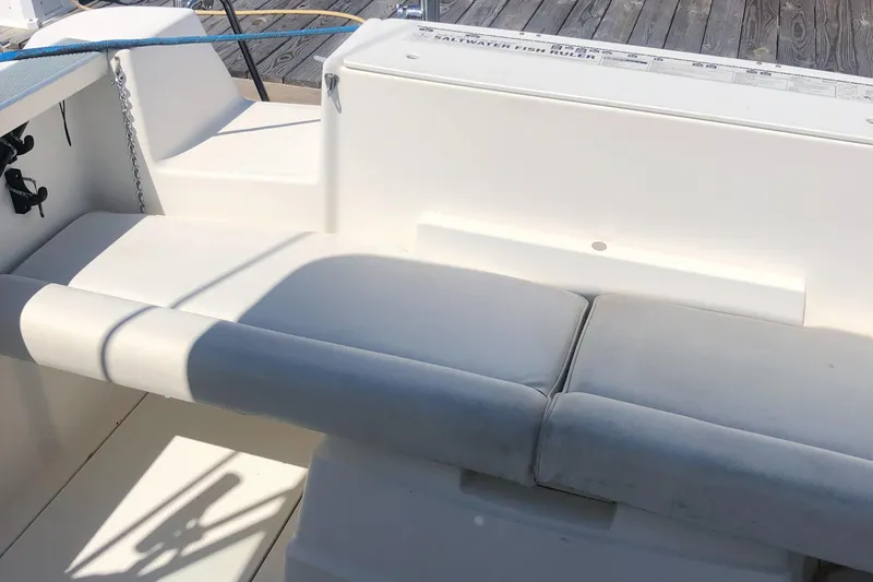 Slide: The Image of 1998 Bayliner 2452 Ciera Express boat interior with cushioned seating. - 20