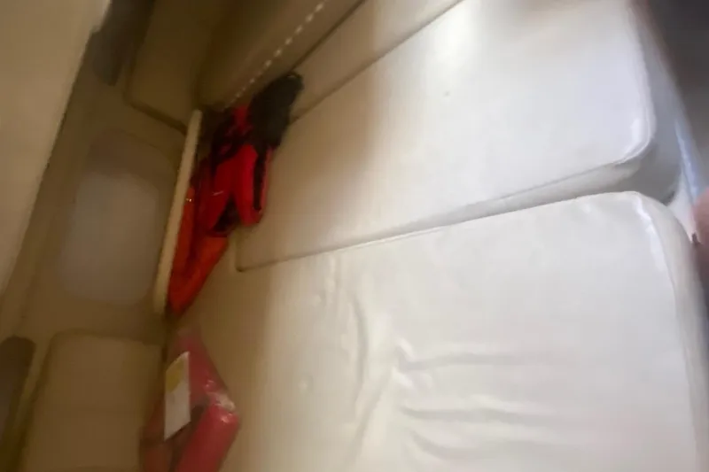 Slide: The Image of Interior cabin of a 2003 Rinker 342 Fiesta Vee with beige cushions. - 7