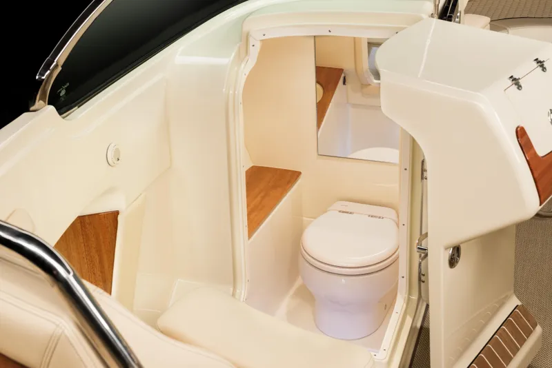 Slide: The Image of 2026 Chris-Craft Launch 28 GT boat interior with compact bathroom and toilet. - 15