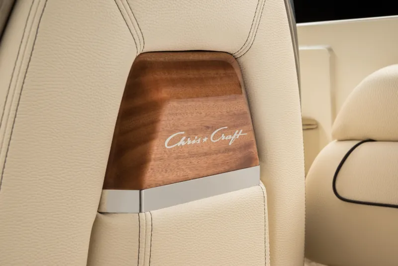 Slide: The Image of Luxurious interior detail of 2026 Chris-Craft Launch 28 GT with wood and leather accents. - 17
