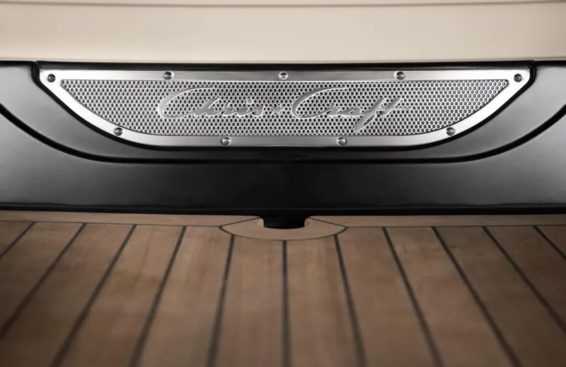 Slide: The Image of 2026 Chris-Craft Launch 28 GT, elegant metal logo on wooden deck background. - 8