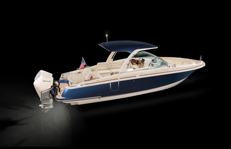 Slide: The Image of 2025 Chris-Craft Launch 31 GT boat with blue hull and outboard motor. - 1