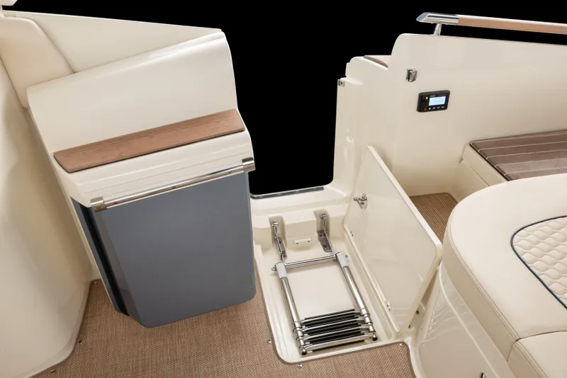 Slide: The Image of Interior of 2026 Chris-Craft Launch 35 GT, featuring storage compartment and elegant seating. - 12