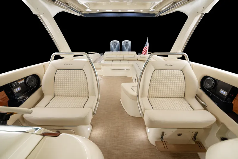 Slide: The Image of Luxurious interior of 2026 Chris-Craft Launch 35 GT boat with elegant seating and American flag. - 4