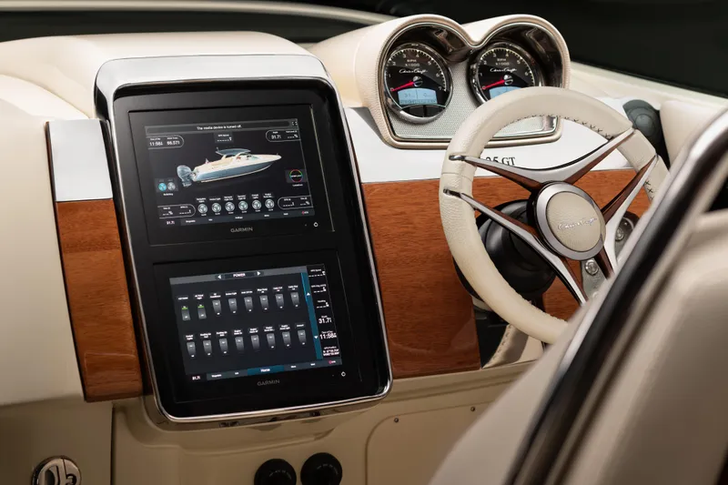 Slide: The Image of 2026 Chris-Craft Launch 35 GT dashboard with touchscreen displays and steering wheel. - 7